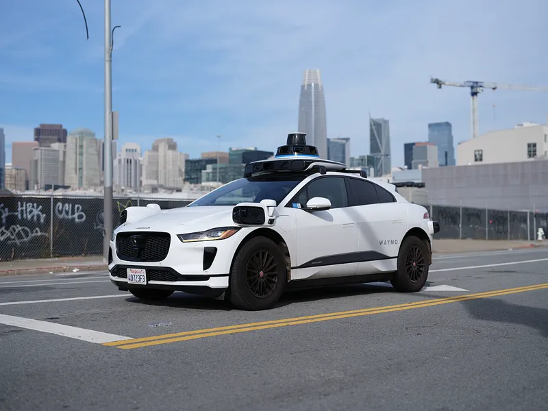 Waymo autonomous vehicle driving on a city street
