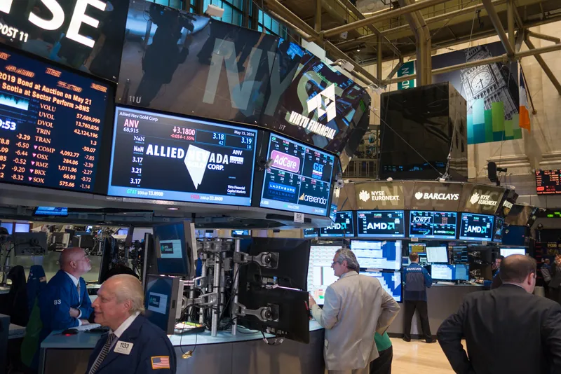 New York Stock Exchange trading floor screens
